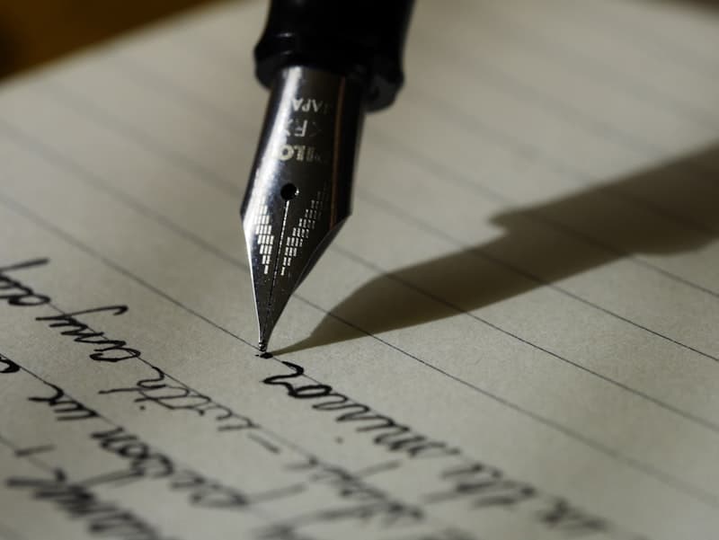 Open notebook with handwritten notes on a café table